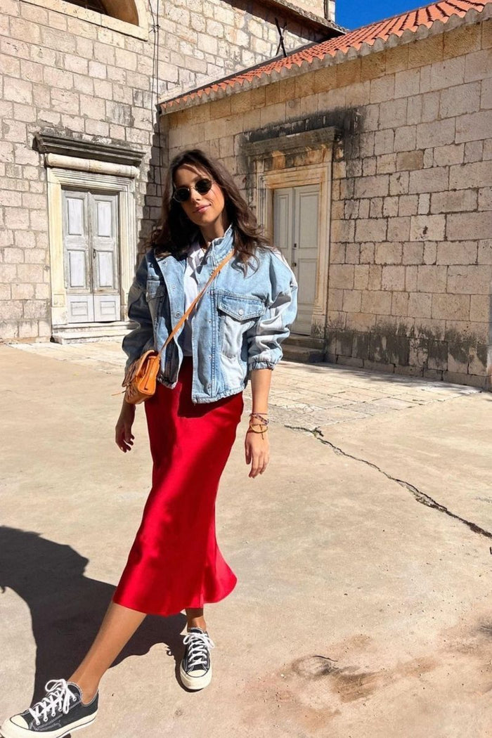 Red midi length satin skirt